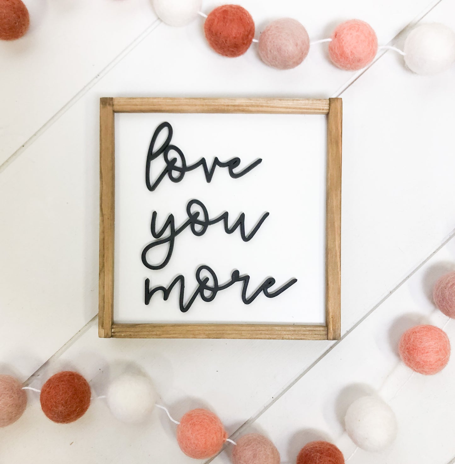 "Love you more" Wood Sign